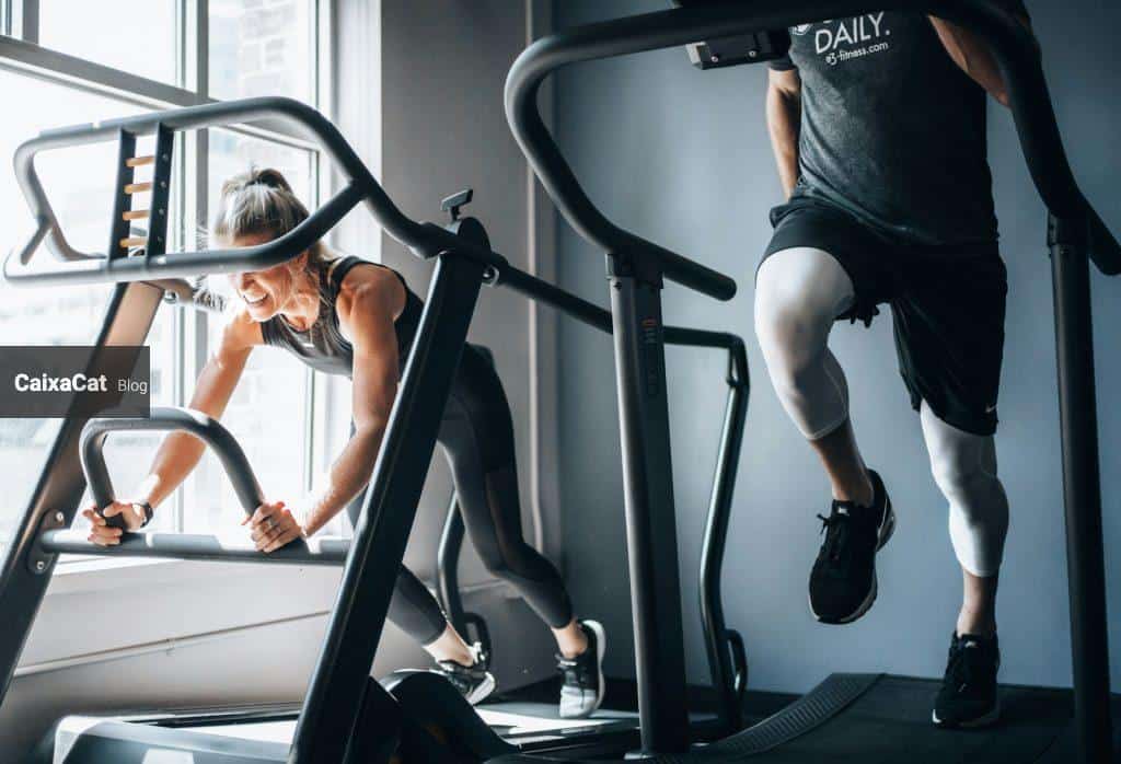 woman in black tank top and black shorts sitting on black exercise equipment
